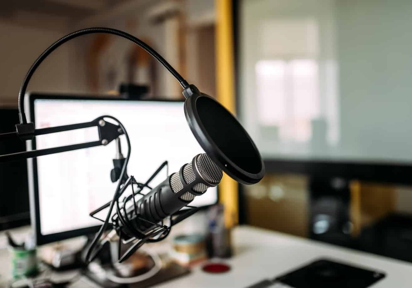 Podcast studio: microphone and computer.